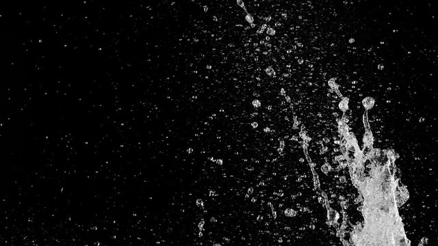 Super slow motion of splashing water isolated on black background. Filmed on high speed cinema camera, 1000 fps.