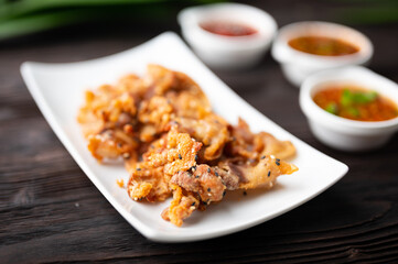 Crispy fried sliced belly pork with spicy sauce
