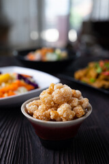 Homemade deep fried crispy pork rind in bowl.