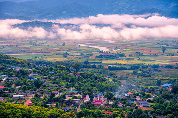 Aerial View of Tha Ton city in the valley with kok rivers, people houses and Temple Chiang Mai province Thailand.