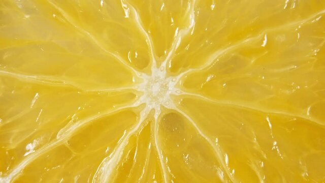 Macro Shot of Slice Orange Fruit and Rotate. Closeup Fresh Citrus Orange. Healthy Food Background. Slow Motion. High quality 4k footage