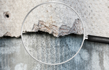 Old and very dangerous asbestos roof. Asbestos dust in the environment. Health problems. View...