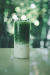 Green tea latte in layer between milk