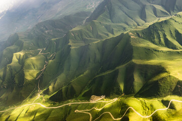 Aerial photos of mountains, grasslands and roads in Urumqi, Xinjiang Province, China