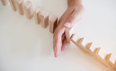 Planning risk and strategy in businessman gambling placing wooden block.Business concept for growth...