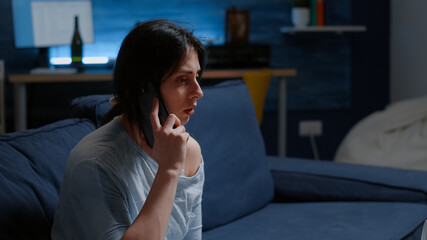 Obraz premium Depressed, scared, shocked, lonely woman dropping phone after hearing horible news, feeling emotionally unstable, traumatised. Person with anxiety suffering major depression because family lost