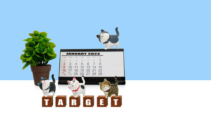 Action plan  for business and marketing. objective, strategy, plan and implement for target , cute cat smiling dolls stand on wooden block with lettering target and calendar,   