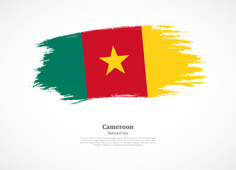 Happy national day of Cameroon with national flag on grunge texture
