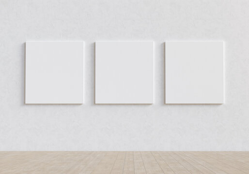 Gallery exhibition interior with three blank mockup canvases. Presentation concept. 3D render.