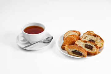 morning tea party. English Afternoon Tea. tea with croissants. light snack between meals. croissant with chocolate on a white background mockup