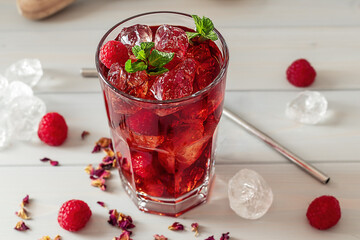 Cold Brew Hibiscus Ice Tea with raspberry and mint.