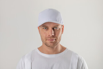 Male worker in a white cap. Mock-up.