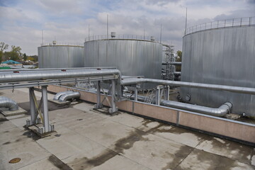 Obraz premium Almaty, Kazakhstan - 10.23.2015 : Pipes and fuel tanks for urban thermal power plant operation