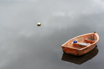 rowing boats reflection on lake