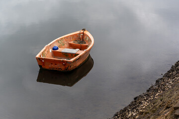 rowing boats reflection on lake