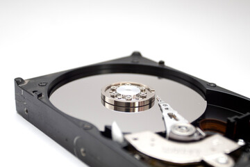 A hard disk drive isolated on white background. Closeup of opened HDD.