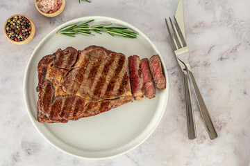 The rib eye or ribeye medium steak, marbled beef meat cooked on the grill.