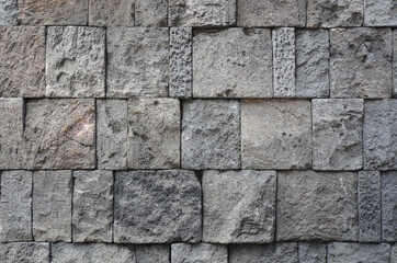 rustic gray granite block wall texture, building exterior or interior background