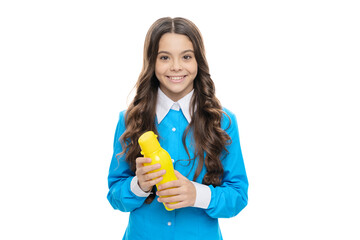 Happy healthy girl hold plastic bottle for thirst quenching isolated on white, water