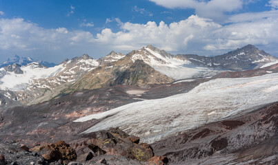 Panoramic view of the Elbrus glaciers. in the foreground we can see the tongue of the Maly Azau glacier. Southwest side of Elbrus. Altitude 3500 m. July 2020