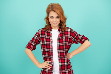 happy redhead woman with curly hair in checkered casual shirt, emotions