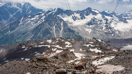 Panorama of the mountains of the Main Caucasian ridge. View from the southern slope of Mount Elbrus. Kabardino-Balkaria. July 2020. Noon