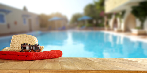 Swimming pool and desk with towel 