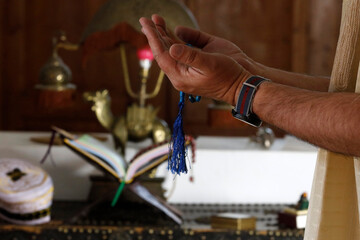 Muslim man pray at home during Ramadan.