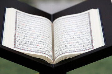 Fototapeta premium Islamic holy book Quran in mosque opened for reading and prayer. Dubai. United Arab Emirates