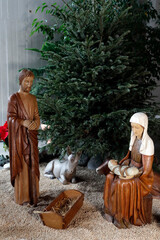 Fototapeta premium Nativity scene. Christmas crib. Holy family with baby Jesus. Catholic church. France.