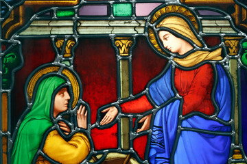 Obraz premium Notre Dame ( our Lady ) d'Aix les Bains church. Stained glass window. The Visitation of Virgin Mary is the visit of Mary with Elizabeth as recorded in the Gospel of Luke. Aix les Bains. France.