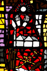 Saint Felix church. Stained glass.  Hands and sun. â€¨ Saint-Felix. France.