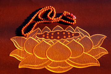 Hong Hien Tu buddhist temple.  Zafu cushion. Lotus flower and prayer beads.  Frejus. France.