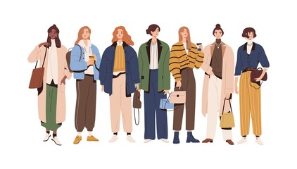 Fototapeta premium Group of stylish women wearing fashion outfits. Young female characters standing in modern casual clothes. People in trendy apparel. Colored flat vector illustration isolated on white background