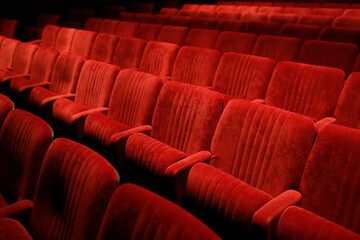 Empty red seats in theater.