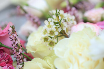 Floral composition of fresh roses, eustoma, ranunculus and astilba. Floral background.