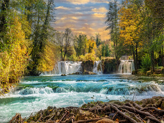 Natural National park with colorful forest and river illuminated by the sunset in fall season in Rastoke, Croatia