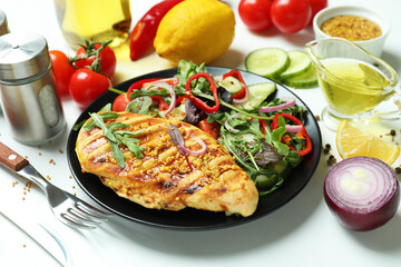 Concept of tasty eating with salad with grilled chicken on white background