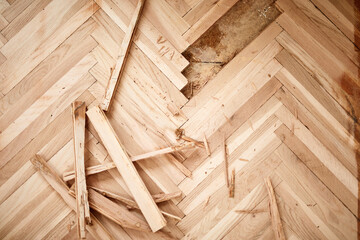 Hardwood floor parquet sanding, removing and replacing bad parts.