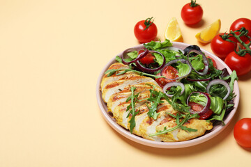 Salad with grilled chicken and ingredients on beige background