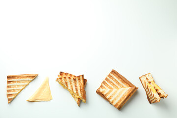 Grilled sandwiches with cheese on white background
