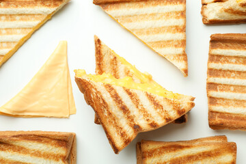 Grilled sandwiches with cheese on white background