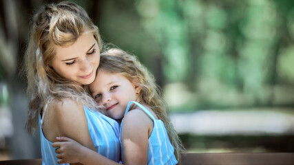 Happy mother and daughter embracing