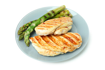 Plate with grilled chicken meat and asparagus isolated on white background