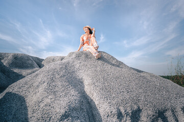 person sitting on a rock