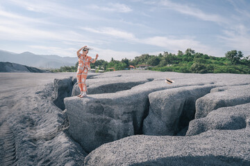 person sitting on a rock