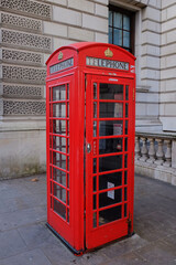 red phone box typical of the streets of london, united kingdom
