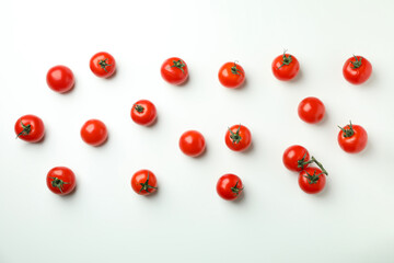 Naklejka na ściany i meble Fresh cherry tomato on white background, top view