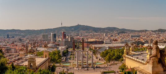 Panoramic view over modern and old districts in historical downtown of Barcelona, Spain, cityscape, at summer sunset colors.