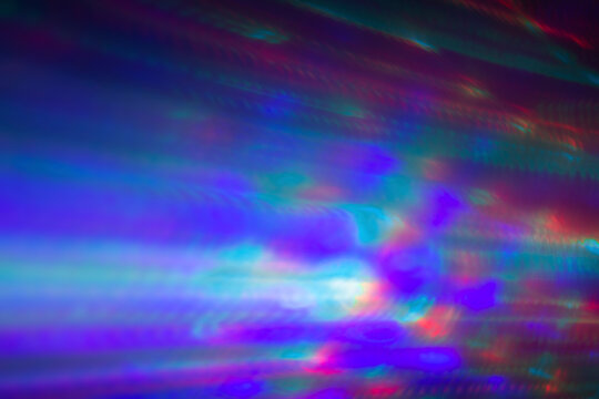 Abstract photo of motion and colorful lights at dark. Abstract high resolution background. Copy space.